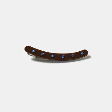 Brown clip with blue rhinestones on a white background
