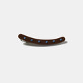 Brown clip with blue rhinestones on a white background