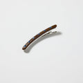 Brown clip with blue rhinestones on a white background