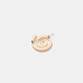 Cream white hair clip with spiral pattern on a white background
