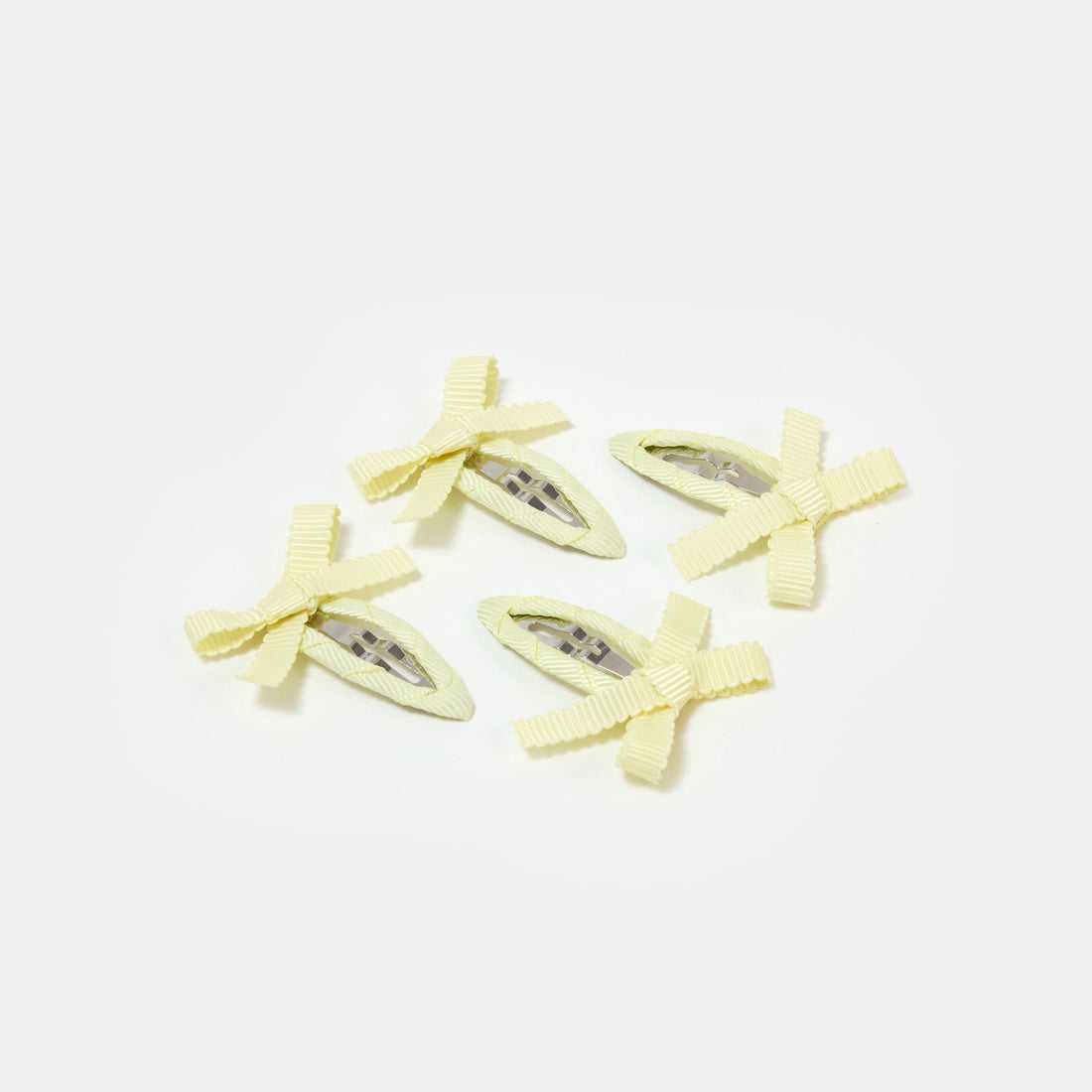 Four yellow snap clips with bows on a white background.