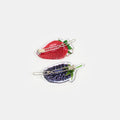 Hair clasp with strawberry and blueberry print design on a white background.