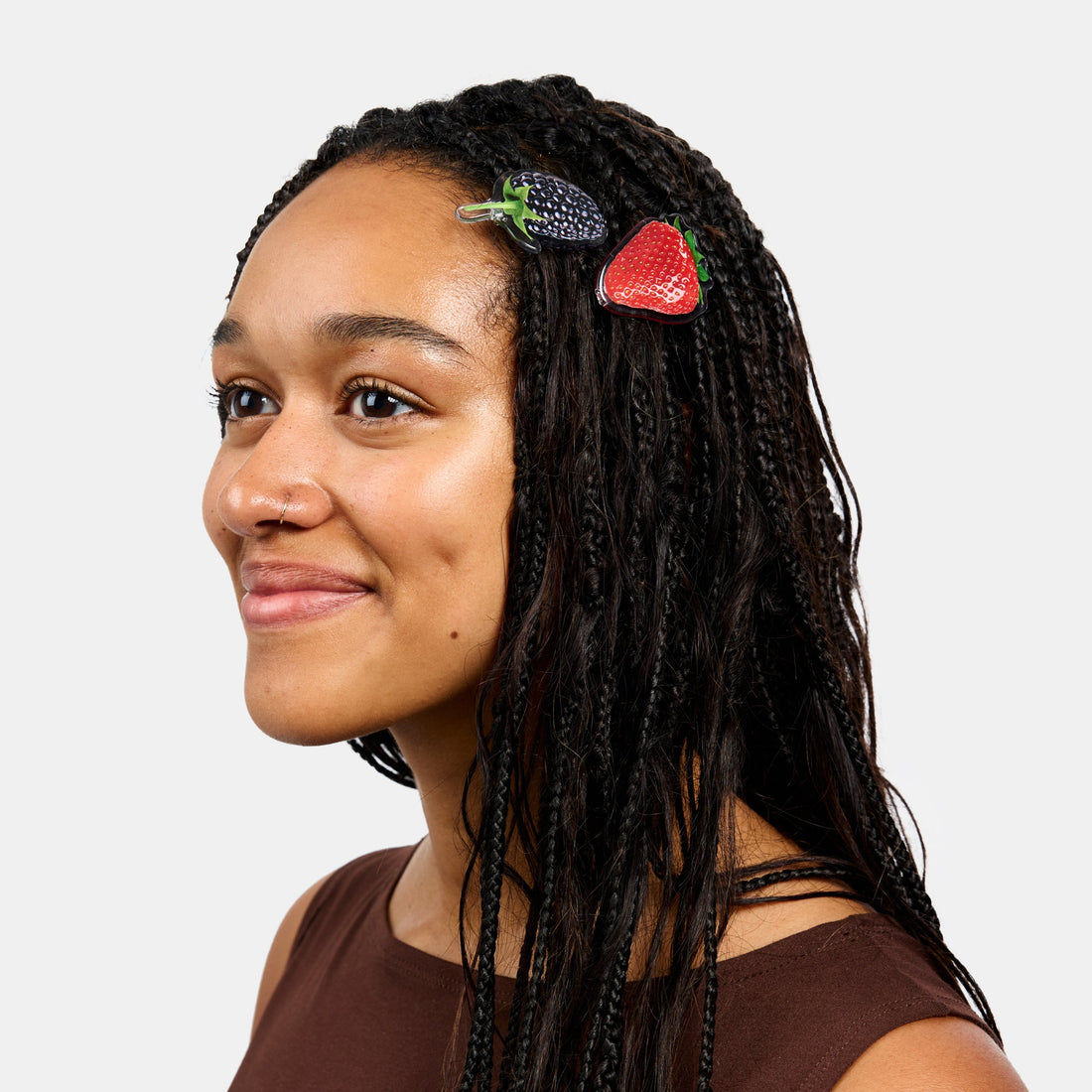 Hair clasp with strawberry and blueberry print design on a white background.