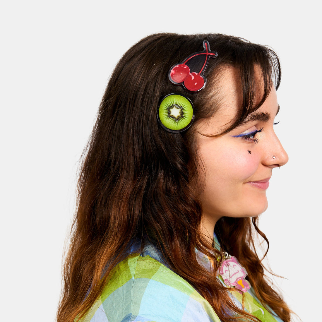 Hair clasps with kiwi, starfruit and cherries print design on a white background